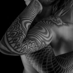 Man And Woman With Arm Sleeve Tattoo