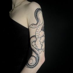 Snake And Flower Tattoo In Black And White On Womans Arms