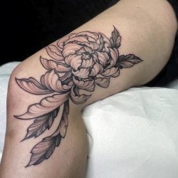 Black Plant Tattoo On Womans Leg