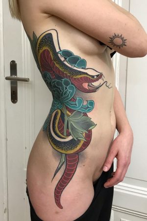 Japan Style Snake Tattoo On Womens Ribs And Leg