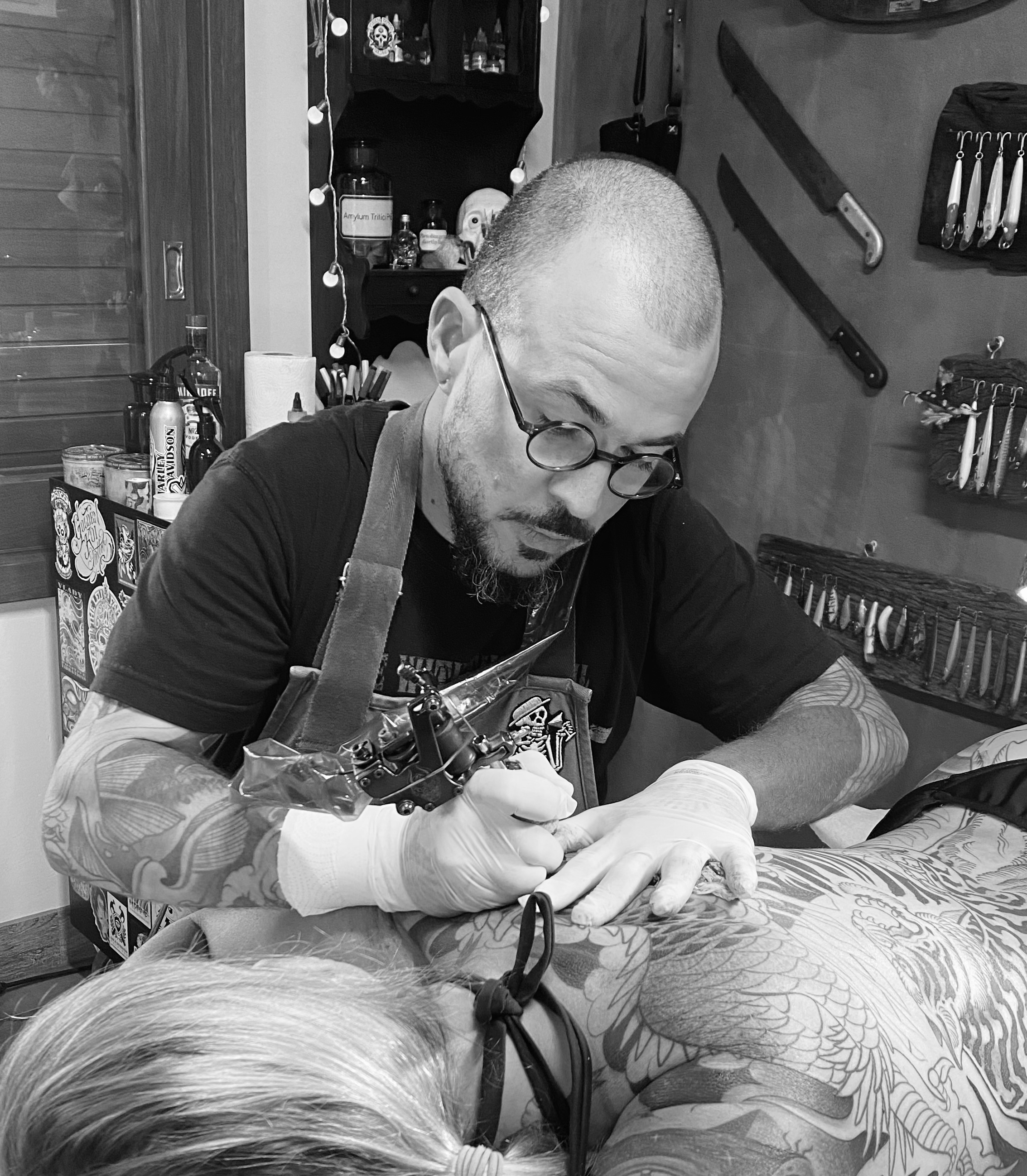 Tattoo Artist at Work on a Back Piece