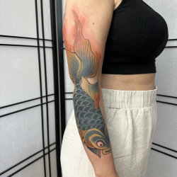 Womans Tattoo Koi On Arm